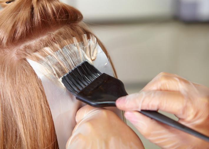 Professional hair color application at a South San Jose salon
